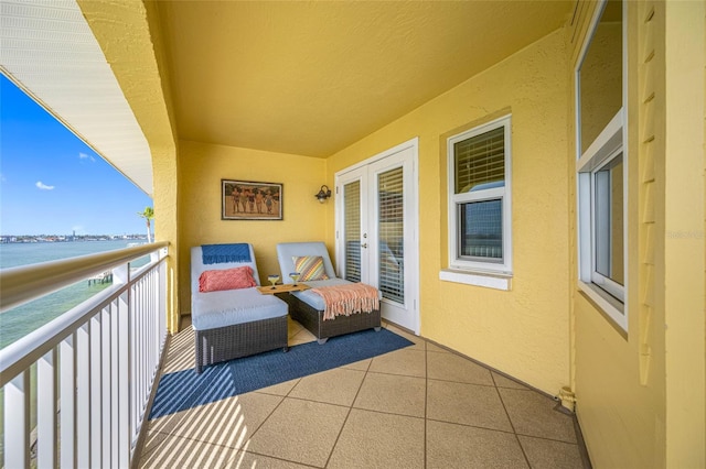 balcony featuring a water view