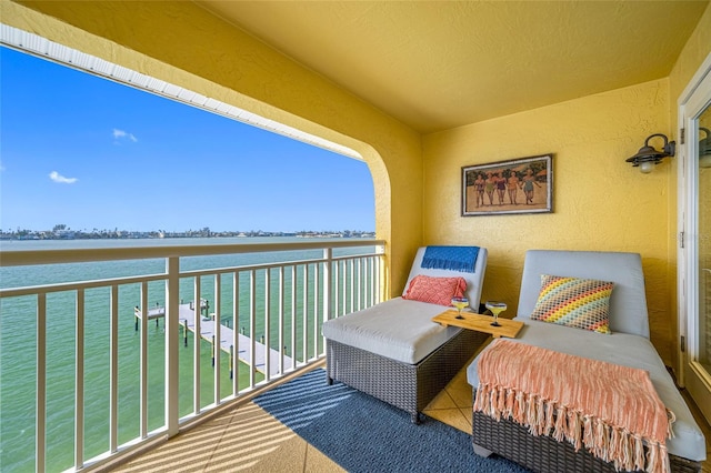 balcony featuring a water view