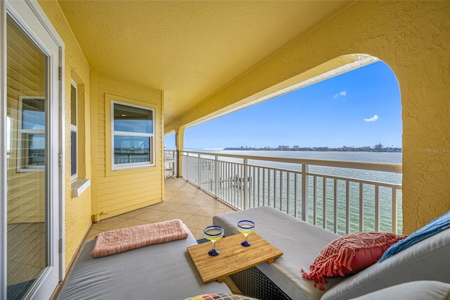 balcony featuring a water view