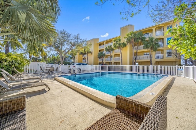 view of swimming pool with a patio