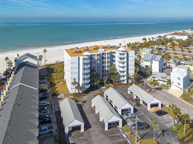 birds eye view of property featuring a view of the beach and a water view