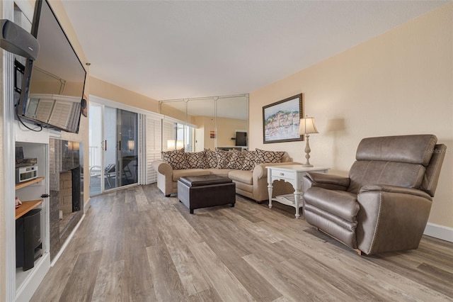 living room featuring hardwood / wood-style floors and track lighting