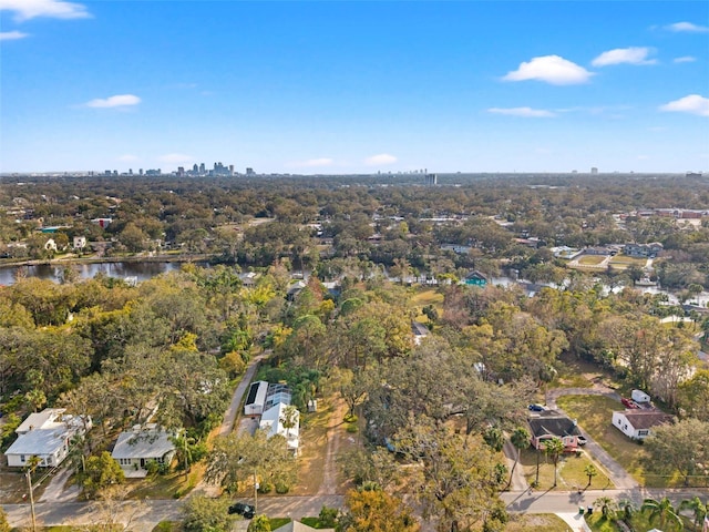 birds eye view of property featuring a city view and a water view