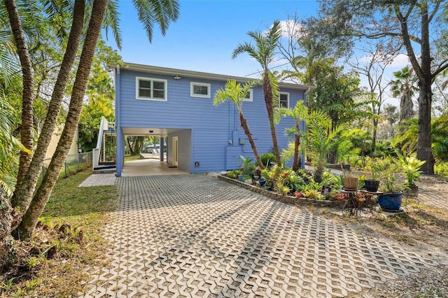 exterior space featuring a carport and driveway