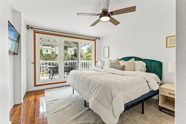 bedroom featuring ceiling fan, access to outside, hardwood / wood-style flooring, and baseboards