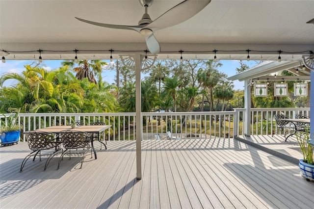 deck featuring a ceiling fan and outdoor dining space