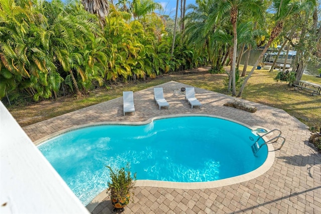 outdoor pool with a patio