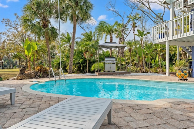 pool with a gazebo, a grill, and a patio