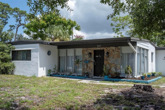 view of front of home with a front yard