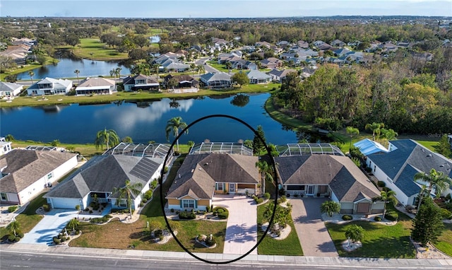 birds eye view of property featuring a water view and a residential view