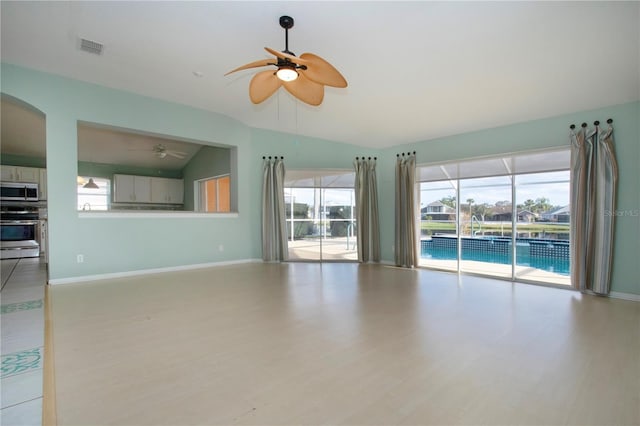 unfurnished living room featuring lofted ceiling, baseboards, visible vents, and light wood finished floors