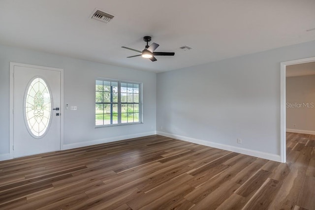 entryway with dark hardwood / wood-style floors and ceiling fan