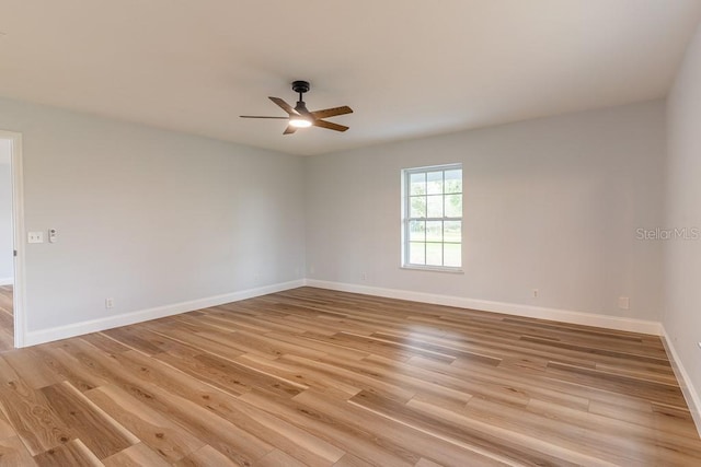 empty room featuring ceiling fan and light wood-type flooring