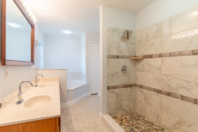 bathroom with tile patterned flooring, vanity, and independent shower and bath