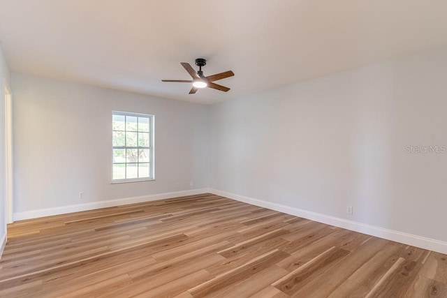 empty room featuring ceiling fan and light wood-type flooring