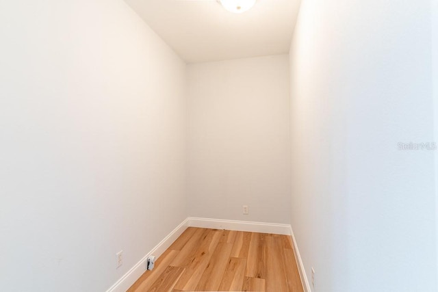 unfurnished room with light wood-type flooring