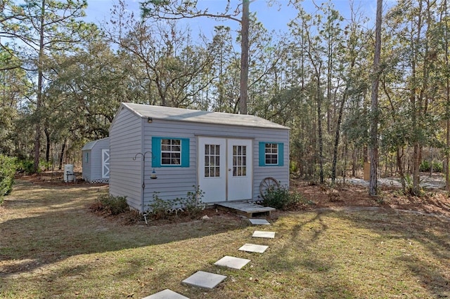 view of outbuilding with a lawn