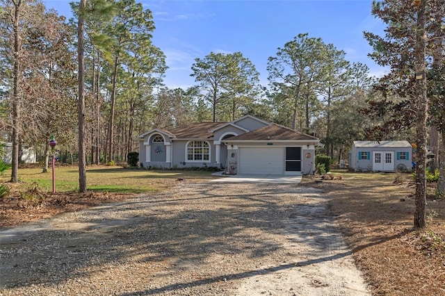 ranch-style home featuring a garage