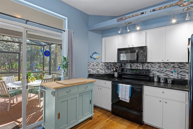 kitchen featuring wood counters, black appliances, light hardwood / wood-style flooring, white cabinets, and backsplash