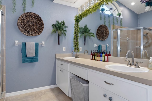 bathroom featuring vanity, an enclosed shower, and tile patterned flooring