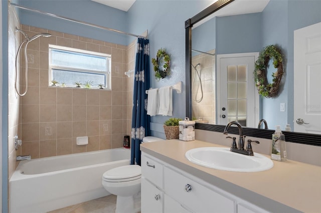 full bathroom with vanity, tile patterned floors, toilet, and shower / bath combo