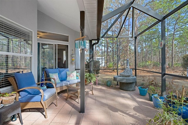 sunroom featuring vaulted ceiling