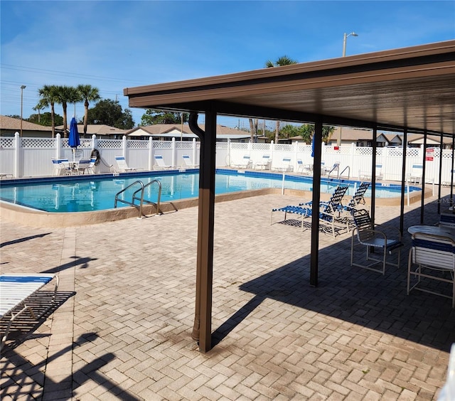 view of swimming pool with a patio