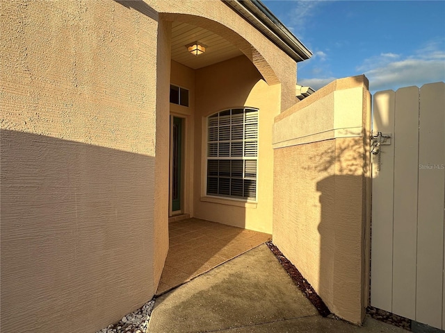 entrance to property with a patio area