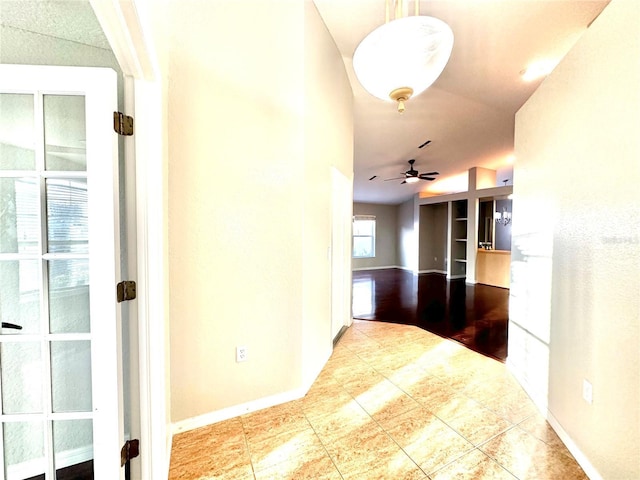 hallway with tile patterned flooring