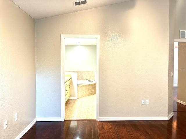 corridor featuring hardwood / wood-style flooring