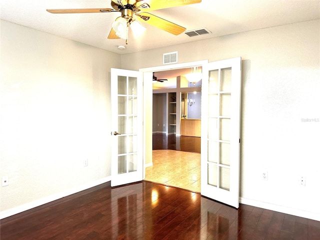 unfurnished room with french doors, ceiling fan, and hardwood / wood-style floors