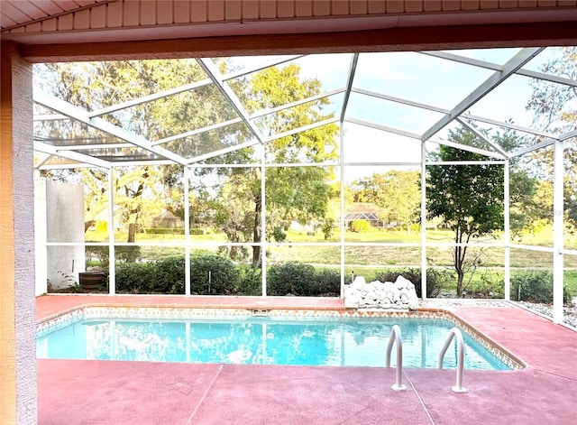 view of pool with a lanai and a patio