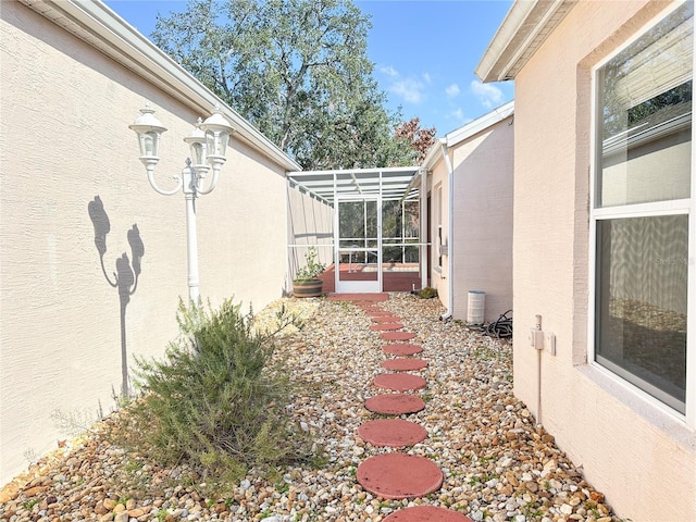 view of yard featuring a lanai