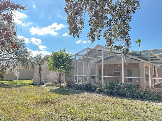 view of yard with a lanai