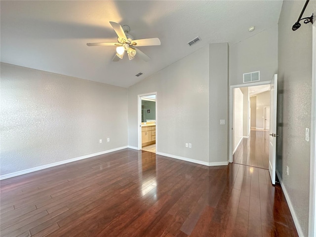 unfurnished room featuring ceiling fan, lofted ceiling, and dark hardwood / wood-style flooring