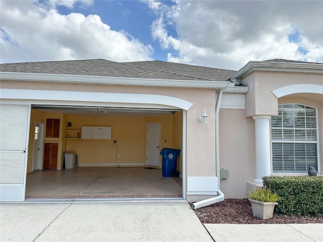 view of exterior entry with a garage