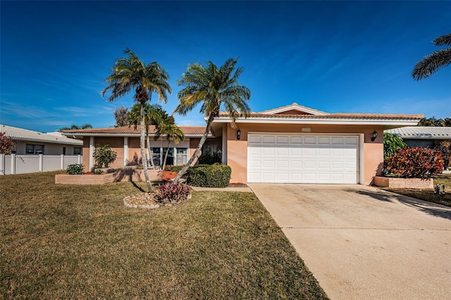 single story home featuring a garage and a front lawn