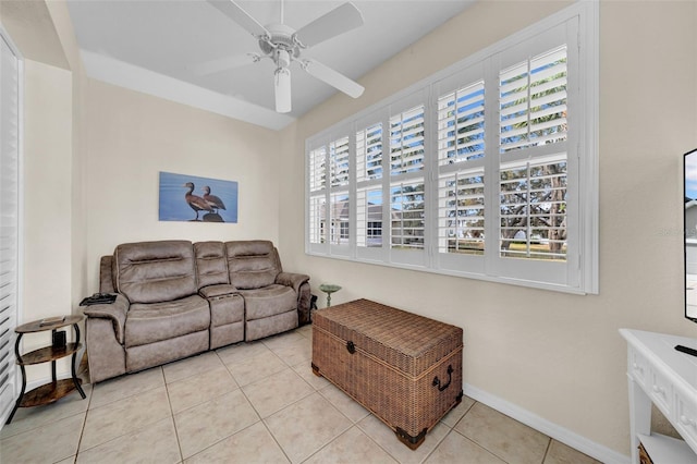 tiled living room with ceiling fan