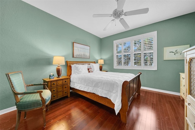 bedroom featuring ceiling fan and dark hardwood / wood-style flooring