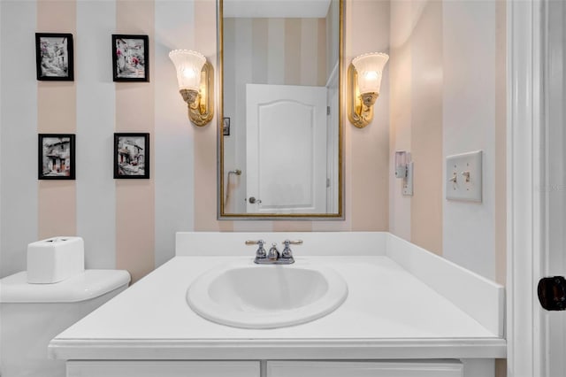 bathroom with vanity and toilet