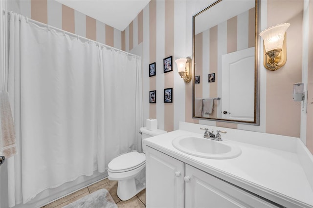 full bathroom with vanity, tile patterned floors, shower / bath combo with shower curtain, and toilet