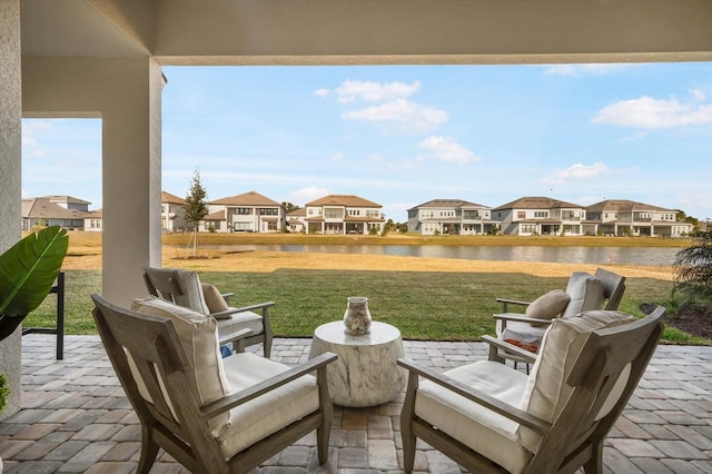 view of patio featuring a water view