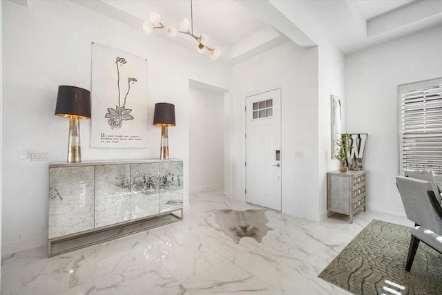 foyer with a notable chandelier