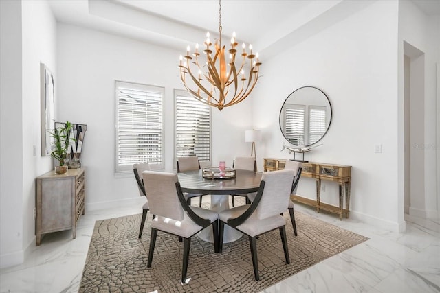 dining space with a notable chandelier