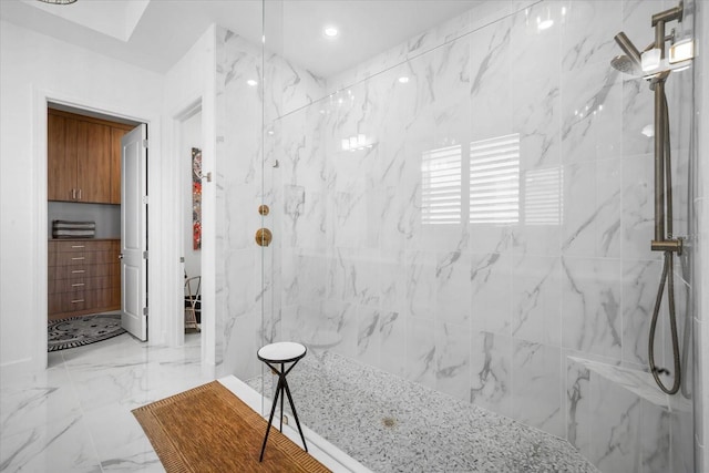 bathroom with a tile shower