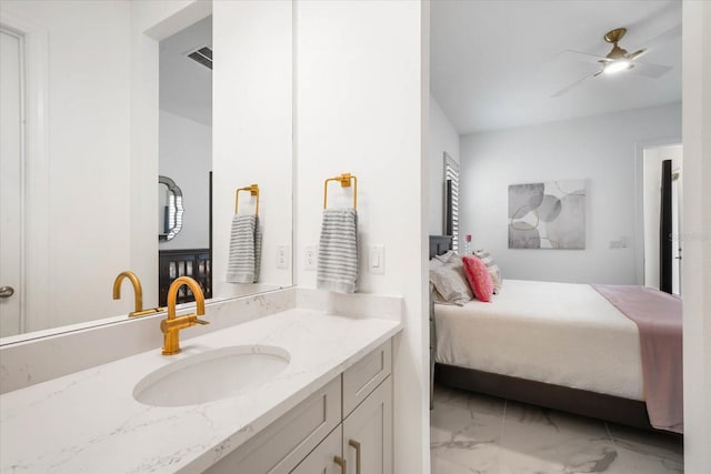 bathroom with ceiling fan and vanity