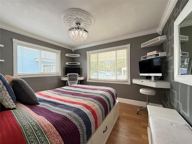 bedroom featuring ornamental molding and multiple windows