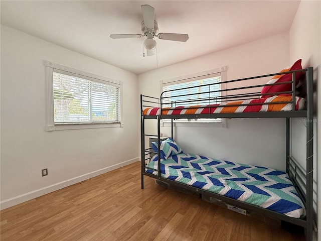 bedroom featuring hardwood / wood-style flooring and ceiling fan