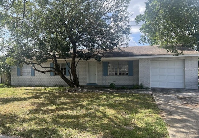 ranch-style house with a garage and a front lawn