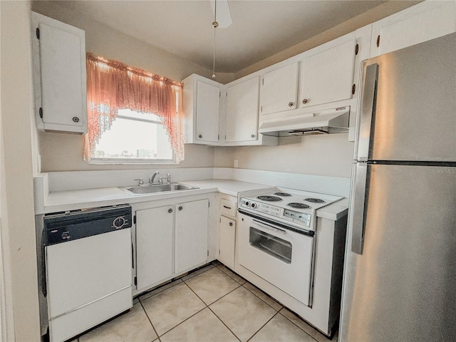 kitchen featuring white cabinetry, sink, white appliances, and light tile patterned flooring